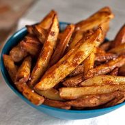 A picture of Baked Spicy Fries with Garlic Cheese Sauce