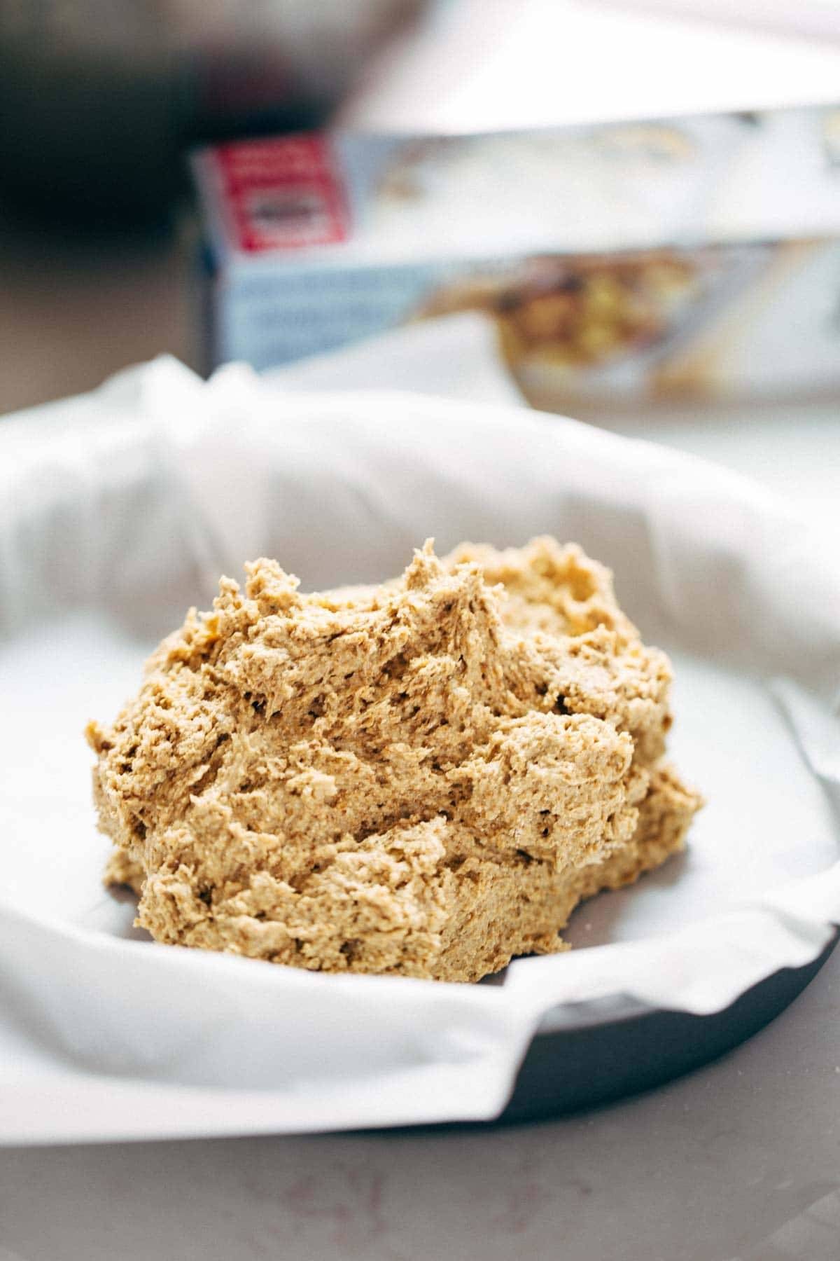 Blueberry Peach Cake recipe uses simple ingredients, whole wheat, no refined sugar, and has a STUNNING presentation. YUM! | pinchofyum.com A plate holding dough for preparation of a cake.