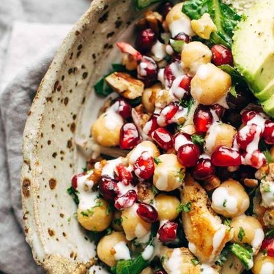Winter Spa salad in a bowl with chickpeas, avocado, and oranges.